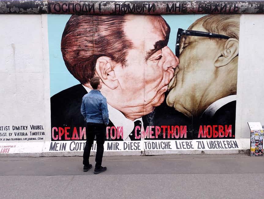 Berlin: From East to West & Wall Tour by Bike with a Guide - Friedrichshain parks, bunkers, and the Grimm fairy tale fountain