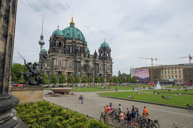 Berlin Highlights Sightseeing Bike Tour in Small Groups - Checkpoint Charlie, Gendarmenmarkt, and Bebelplatz, the city’s sharp contrasts