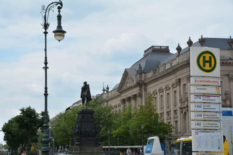 Berlin: Historic Center Walking Tour with a Real Berliner - Brandenburg Gate at reunification crossroads
