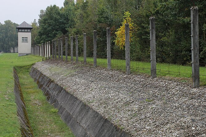 Dachau Small-Group Half-Day Tour from Munich By Train - The Jourhaus and the gate message you cannot ignore