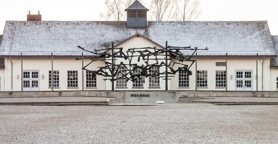 From Munich: Dachau Memorial Site Full-Day Tour - Jourhaus and the Arbeit Macht Frei Sign: The Tone Setter