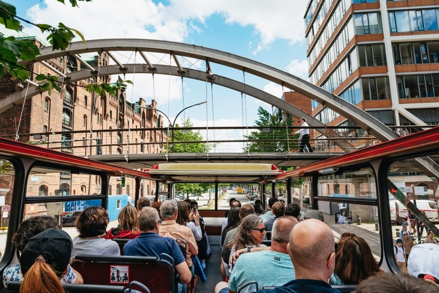 Hamburg: Hop-On Hop-Off Bus with Harbor Cruise - Audio guides, headphones, and the one moment you might feel out of sync