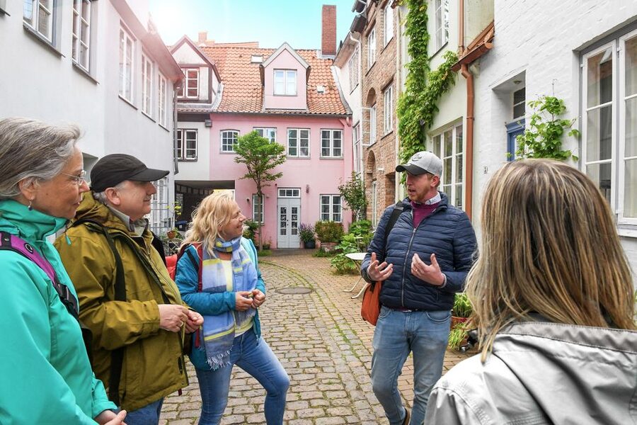 Lübeck: Entertaining Tour Through Hidden Courtyards - Finding the Burgtor Meeting Point in Real Life
