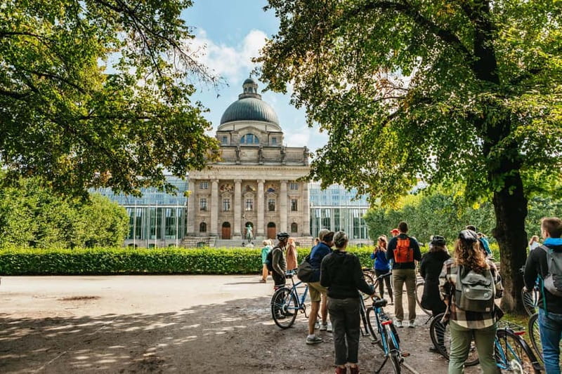 Munich: Guided City Tour by Bike with Beer Garden Stop - The English Garden ride with Eisbach river surfers