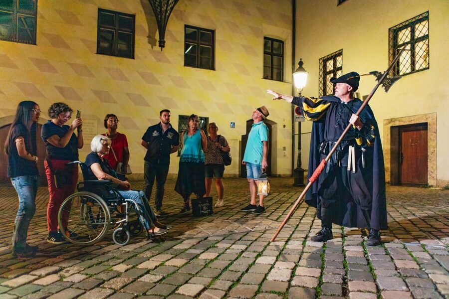 Munich: Middle Ages Tour with Night Watchman - Talburg Gate closing and the halberd fight moment