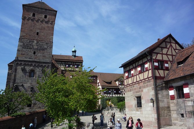 Nuremberg Old Town and Nazi Party Rally Grounds Walking Tour in English - The switch to the Nazi party rally grounds, with bus or train included